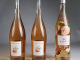 three bottles of wine sitting next to each other on a table