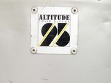 a sticker that says altitude on the side of a plane