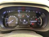 a close up of a car dashboard with various gauges