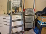 two ladders and a chair in a room
