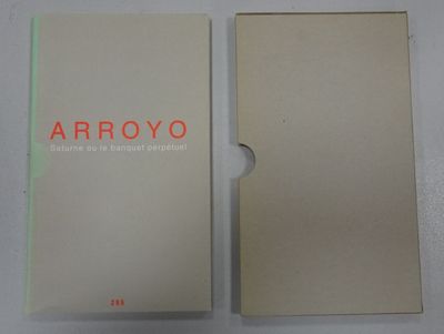 an open book with a white cover and red writing on it