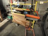 a man that is working on a machine in a garage