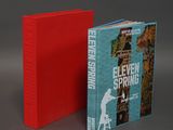 two books are sitting side by side on a gray surface