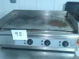 an image of a stove top with a lot of condiments on it