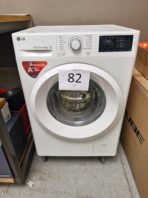 a washing machine that has a price tag on it