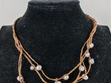 a close up of a necklace on a mannequin mannequin