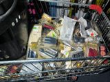 a shopping cart full of cosmetics and other items
