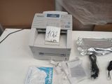 an image of a printer and other items on a table