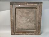 an old wooden picture frame with a white background on a white surface