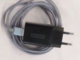 a cable that is connected to a charger on a table