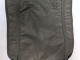 the back view of a gray bag with a zipper on it