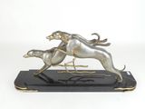 statue of a dog chasing a cat on a black marble base