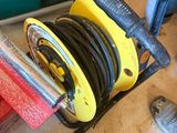 a red and yellow hose sitting on top of a clamp
