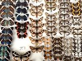 many different types of butterflies on display in a display case