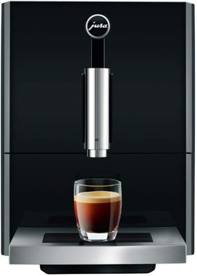the jura coffee machine has a glass of coffee in front of it