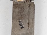 a close up of a knife on a white surface