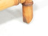 a close up of a bed with a wooden headboard and foot board