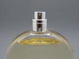 a close up of a bottle of perfume on a table