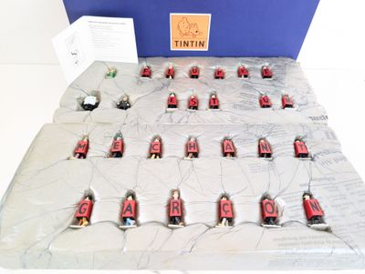 a lot of small red and black toys on a table