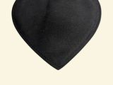 a black heart shaped bag hanging from a pink string