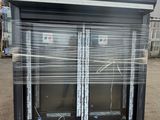two windows that are wrapped in plastic on a pallet