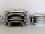 a lot of plates and a bowl on the table