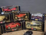 several toy cars are stacked on top of each other on a table