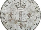 an old silver coin with a crown on top of it