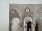 a black and white photo of an elephant in a building