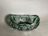 green and white glass bowl with a pattern of leaves on it