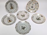 six plates with different designs on them on a white surface