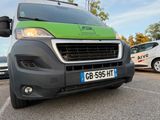 a green van that is parked in a parking lot