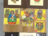 a lot of drawings and pictures on the wall
