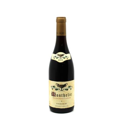 a bottle of wine sitting on top of a white table