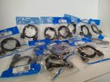 a lot of different types of headphones on the table