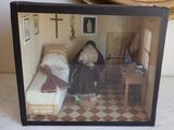 a picture of a doll house with two dolls in it