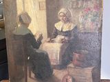 un vieux tableau représentant une femme en train de lire un livre posé sur un chevalet