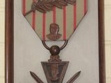 a picture of a medal hanging on a wall