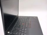 a laptop with a black keyboard on a white surface