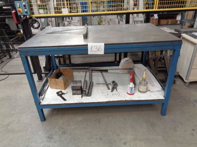 a workbench with tools on it in a warehouse