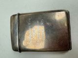 a small metal box with a silver lid