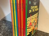 a stack of children ' s books sitting on top of a table