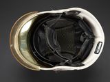 an overhead view of a helmet with a visor on a black background