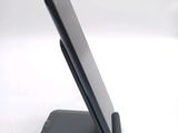 a cell phone that is sitting on top of a stand