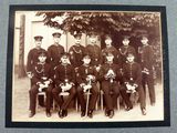 an old photo of a group of men in uniform