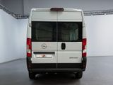 a white van that is parked inside of a building