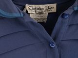 a close up of a blue shirt with a label on it
