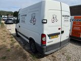 a white van that is parked in a parking lot