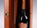 a bottle of champagne in a wooden box on a white background