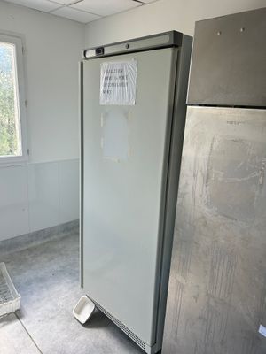 an image of a kitchen with a refrigerator and a window